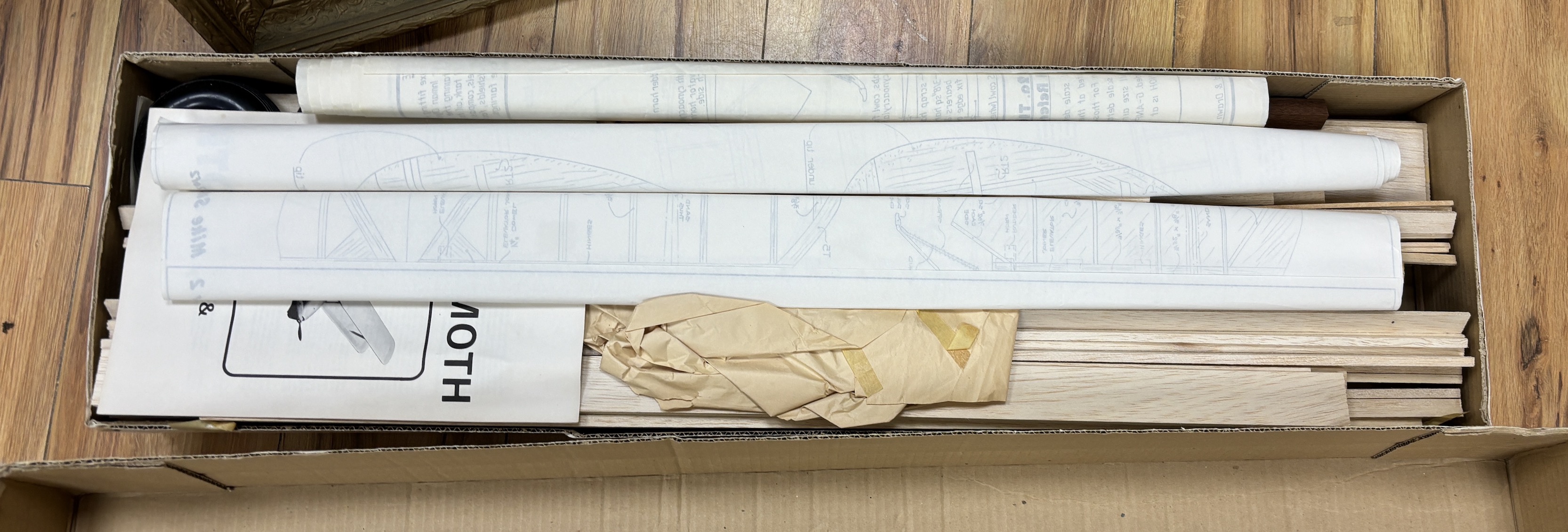 Two large wooden aircraft kits; a D.B. models Mannock and a Pegasus D.H. 82A Tiger Moth, longest box 106cm